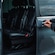 A private driver opening the door of a luxury minivan